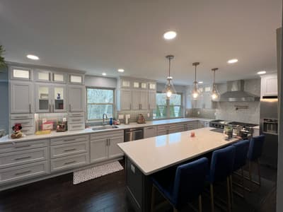 White kitchen renovation with island seating by KRidge Construction