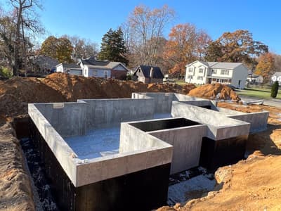 Poured concrete foundation walls for a new home build under construction by KRidge Construction