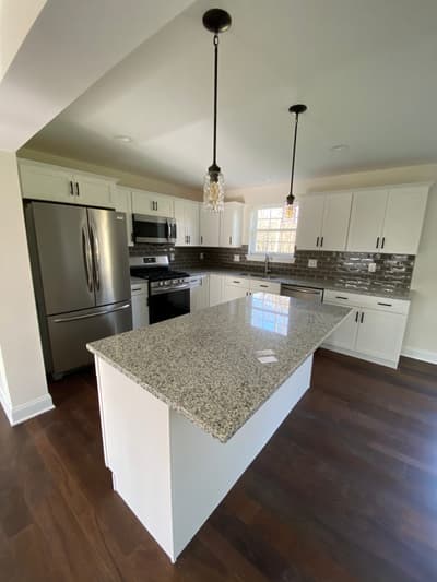 Kitchen remodel with dark tile backsplash by KRidge Construction