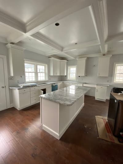 Kitchen remodel in progress with new cabinetry and countertops